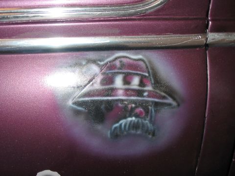 1986 Ford Bronco - Close-up of custom airbrushed artwork on the side of a vehicle.