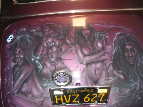 1986 Ford Bronco - This vehicle features custom airbrush art depicting four women, along with a California license plate.