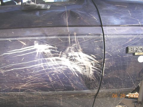 1994 Ford Bronco - This 1994 Ford Bronco's side panel shows extensive damage from off-roading.