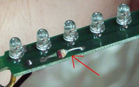 1985 Ford Crown Victoria LTD - Close-up of a circuit board showing several LEDs and a resistor, with a red arrow pointing to the resistor.