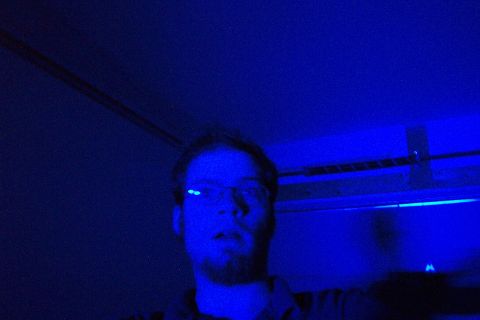 1985 Ford Crown Victoria LTD - A man is illuminated by blue light, with the Supermotors logo visible in the corner.