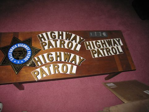 1991 Ford LTD Crown Victoria - California Highway Patrol badge and lettering displayed on a wooden surface.