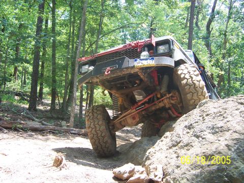 1978 Ford Bronco - This 1978 Ford Bronco navigates a rocky trail with its front right tire high in the air.