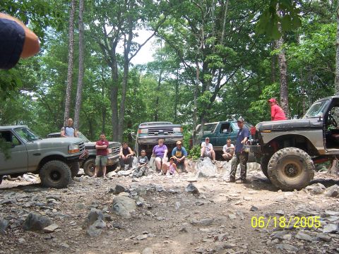 1978 Ford Bronco - A group of off-road enthusiasts and their vehicles gathered in a rocky, wooded area on June 18, 2005.
