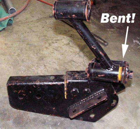 1988 Ford Bronco - A bent suspension bracket is shown, with an arrow pointing to the damaged area and text indicating it is 'Bent!'.