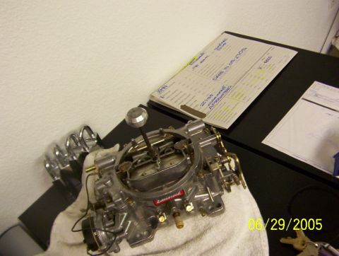1985 Ford Bronco - Carburetor shown on a towel with a date stamp in the corner.