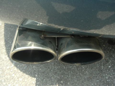 1993 Ford Taurus - Close-up of dual exhaust tips on a vehicle, showing the 'BOSS' brand.