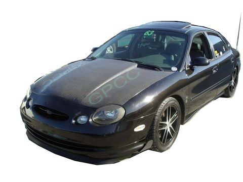 1993 Ford Taurus - This sedan features a custom hood and racing decals, suggesting a modified appearance.