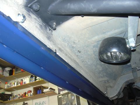 1991 Ford Bronco - Close-up view of the undercarriage and rock sliders of a vehicle.