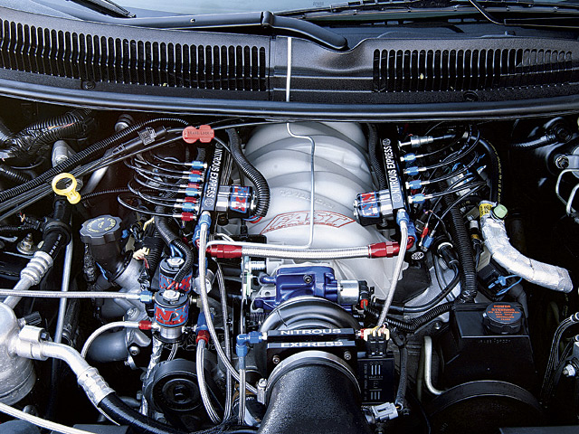 Engine bay with Nitrous Express system, showing fuel rails, lines, and intake manifold