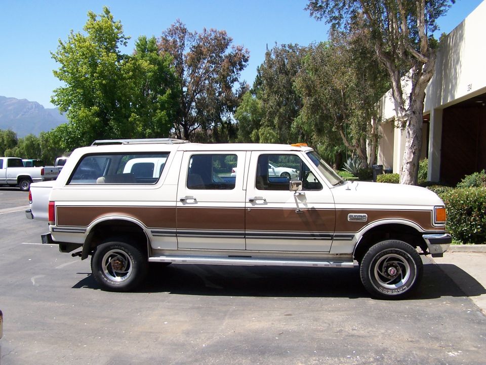 1988 Ford C-350 Centurion Conversion van, side view, white with woodgrain trim