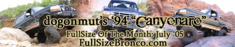 1996 Ford Bronco - Three Ford Broncos navigate a challenging off-road course in a desert landscape.