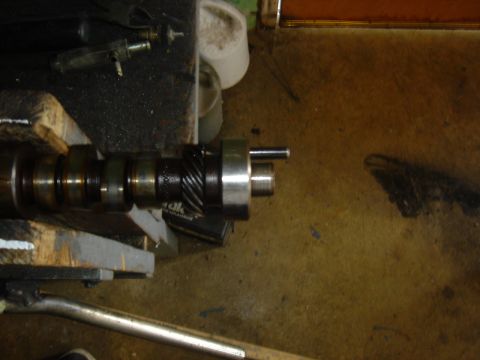 1986 Ford Mustang - A camshaft is shown secured in a vise, ready for inspection or modification.