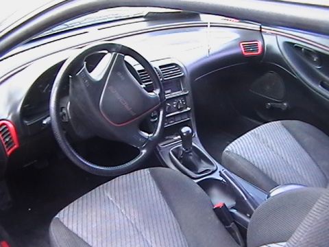 1993 Ford Probe - Interior view of a 1993 Ford Probe, the dashboard, steering wheel, and seats.