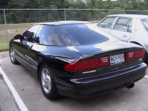 1993 Ford Probe - Rear view of a black 1993 Ford Probe with a license plate M49-YGH.