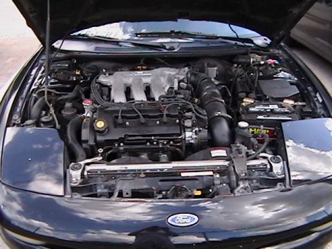 1993 Ford Probe - Engine bay of a 1993 Ford Probe, showing the V6 engine and front end details.