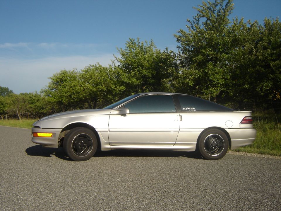 Silver 1990 Ford Probe coupe, side view