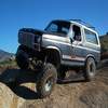 1986 Ford Bronco - This 1986 Ford Bronco is shown off-roading on a sunny day.
