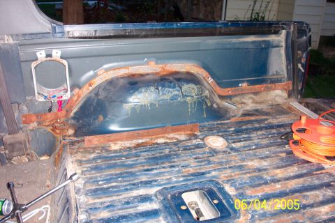 1988 Ford Bronco - Rear seat and carpet removed. Backseat bracket is angle iron. Original seats gone, seats are from conversion van.