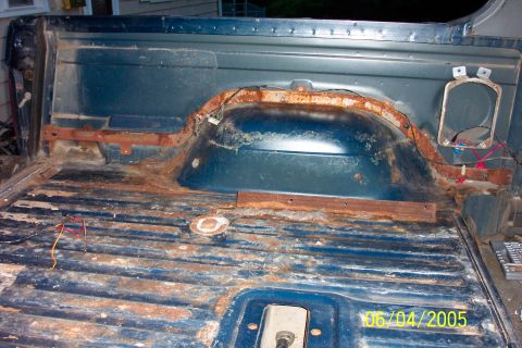 1988 Ford Bronco - Rear seat and carpet removed. Backseat bracket is angle iron. Original seats gone, seats are from conversion van.
