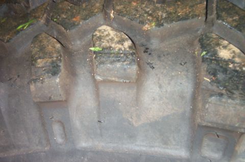 1987 Ford Bronco - Tire tread detail showing deep grooves and lug pattern.