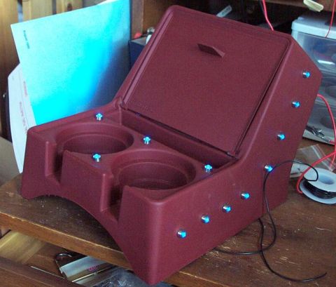 1985 Ford Crown Victoria LTD - Custom maroon center console with dual cup holders and integrated blue LED lighting, likely for a vehicle interior.