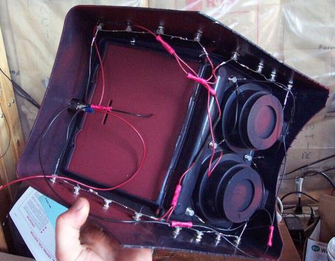 1985 Ford Crown Victoria LTD - Custom speaker enclosure with wiring and two speaker mounts is held by a hand.