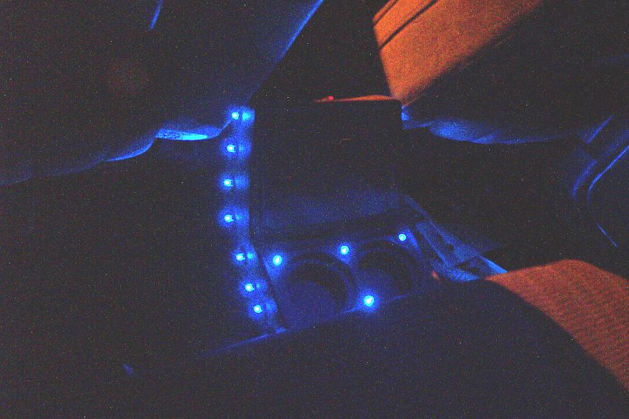 Car interior with blue LED lights on the center console