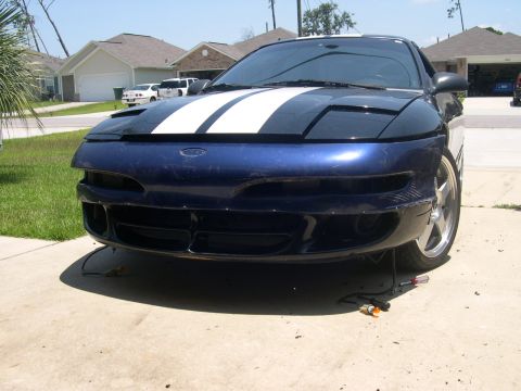 1997 Ford Probe - Front bumper assembly for a Ford Probe, showing racing stripes on the hood.