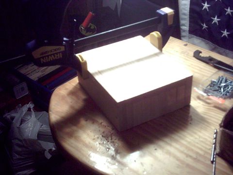 1990 Ford Bronco - A wooden block is clamped and being worked on, with screws and tools nearby.