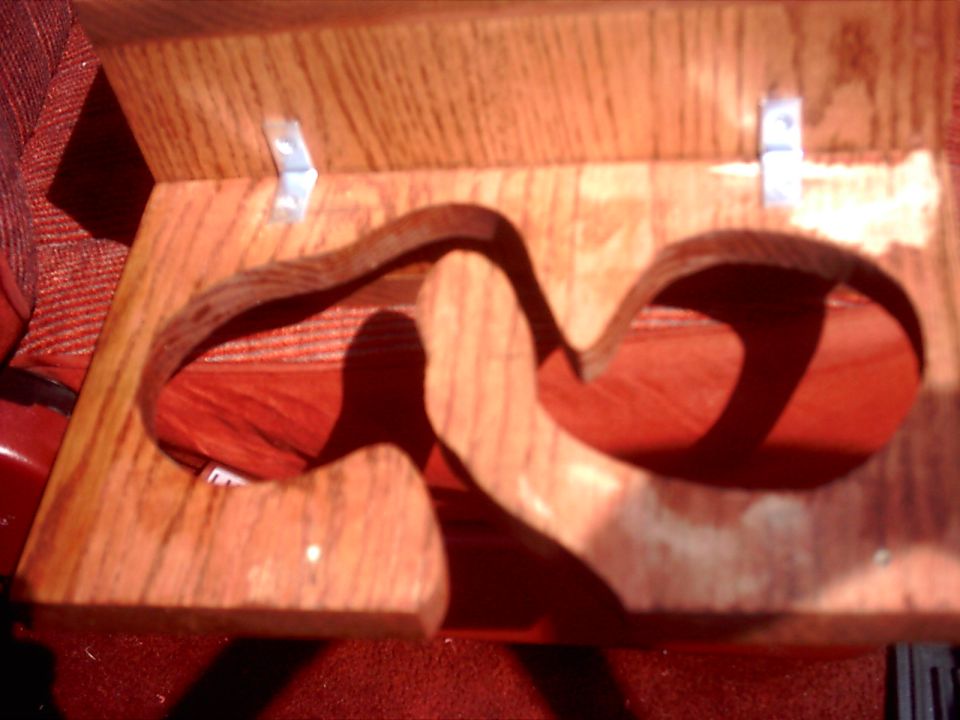 Custom wooden dual cup holder with red fabric visible underneath