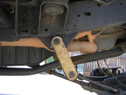 1994 Ford Bronco - Close-up of the undercarriage, showing suspension components and exhaust system. The Supermotors.net watermark is present.