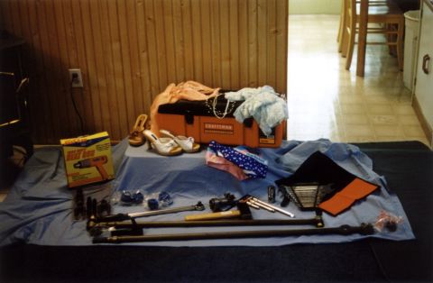 1979 Ford Bronco - Various tools and clothing are spread out on a blue tarp, with a toolbox and a heat gun box visible.