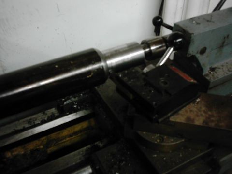 1978 Ford Bronco - Machining a metal shaft on a lathe, likely for a vehicle part.