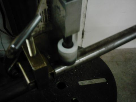 1978 Ford Bronco - Grinding a metal pipe with a rotary tool.