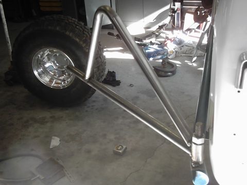 1978 Ford Bronco - A close-up view of a spare tire carrier assembly, showing the tire and mounting hardware.