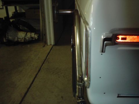 1978 Ford Bronco - The spare tire carrier is visible on the rear of the vehicle, with a chrome accent and reflector.