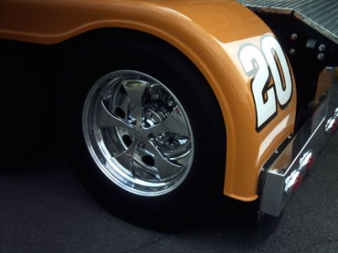 1995 Ford Probe - Close-up of a race car's rear wheel and fender, showing the number 20.