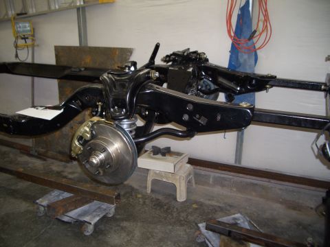 1967 Pontiac GTO - The chassis frame, front suspension, and disc brakes are visible in this image.