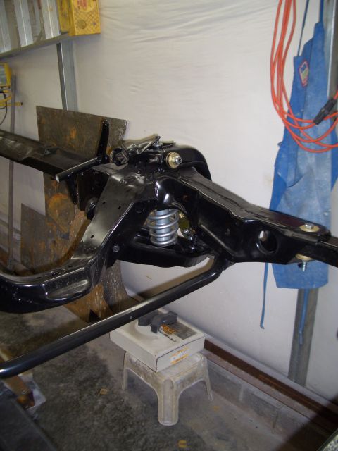 1967 Pontiac GTO - Front suspension assembly of a car frame, likely undergoing restoration or repair.
