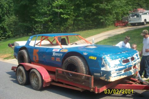 1979 Ford F-150 - A blue stock car with the number 5 and Hoosier decals is loaded onto a trailer.
