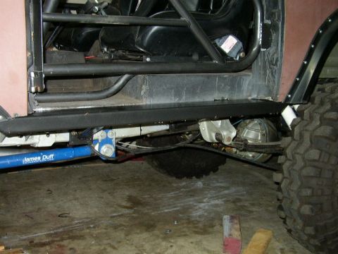 1995 Ford Bronco - Modified off-road vehicle interior showing racing seats and suspension components.