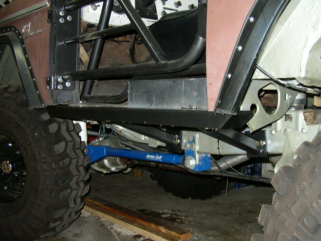 1995 Ford Bronco with custom roll cage and suspension components visible