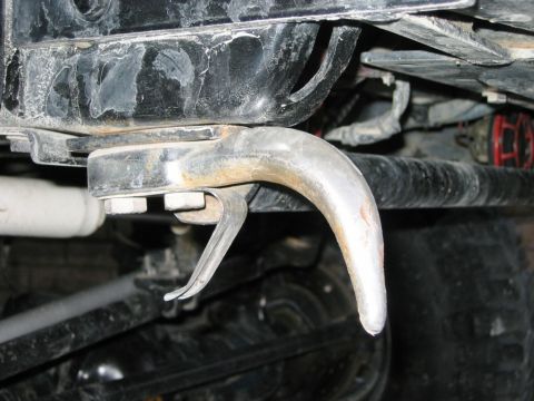 1985 Ford Bronco - A close-up view of a vehicle's tow hook and suspension components is visible.