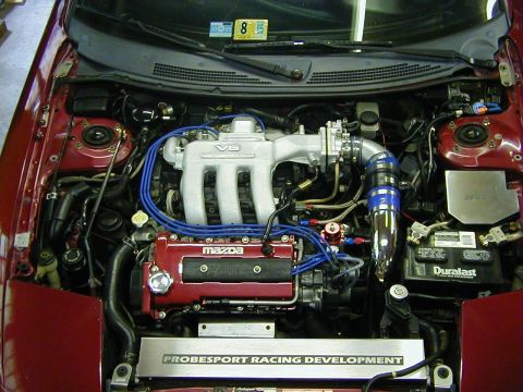 1994 Ford Probe - Engine bay view of a Mazda V6, a 'PROBESPORT RACING DEVELOPMENT' plate.