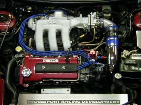 1994 Ford Probe - Engine bay view of a Mazda V6 engine with custom modifications.