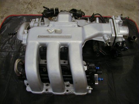 1994 Ford Probe - A silver DOHC 24-valve engine intake manifold is shown, likely a replacement part.