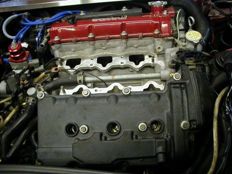 1994 Ford Probe - Close-up view of an engine's internal components, including the valve cover and intake manifold.
