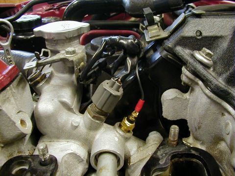 1994 Ford Probe - Engine component with sensor and wiring, likely part of a cooling or temperature system.