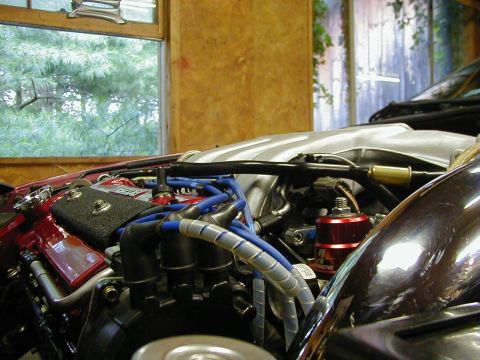 1994 Ford Probe - Close-up view of a car's engine bay, showing various components and wiring.